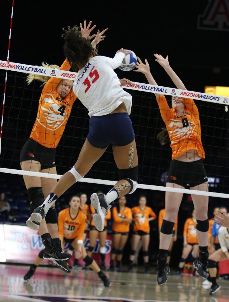 Arizona outside hitter Tyler Spriggs (35) spikes the ball over Oregon State defense on Nov. 9 in McKale Center. The Wildcats fell to the Beavers 0-3.