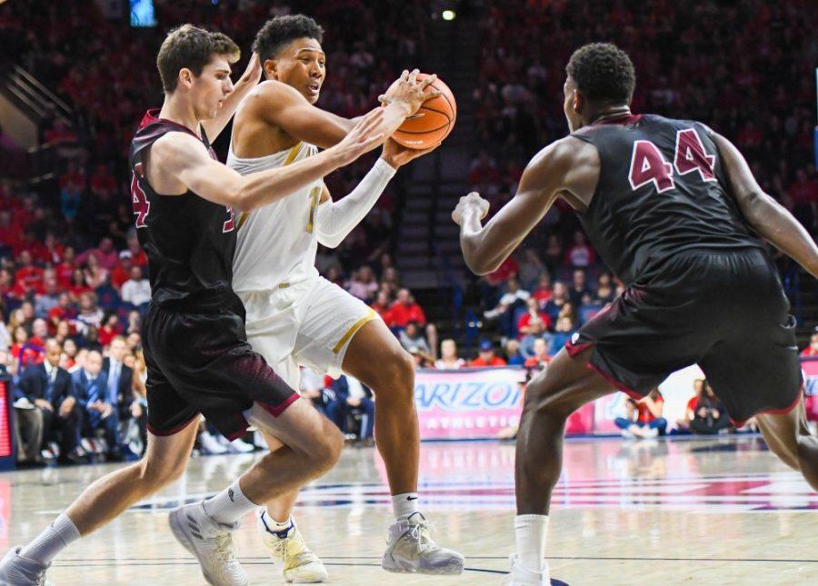 Arizona+forward+Ira+Lee+keeps+the+ball+away+from+Chico+State+defense+on+Nov.+5+in+McKale+Center.