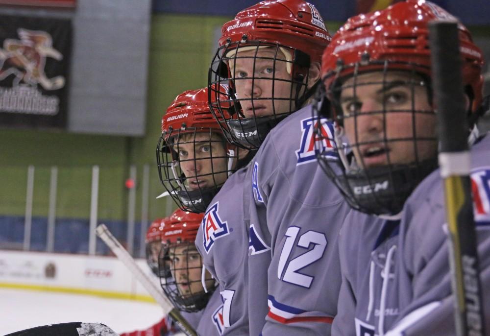 Christopher Westlund (12) and teammates look on during their Nov. 2 game against the CU Buffaloes at the Tucson Convention Center.