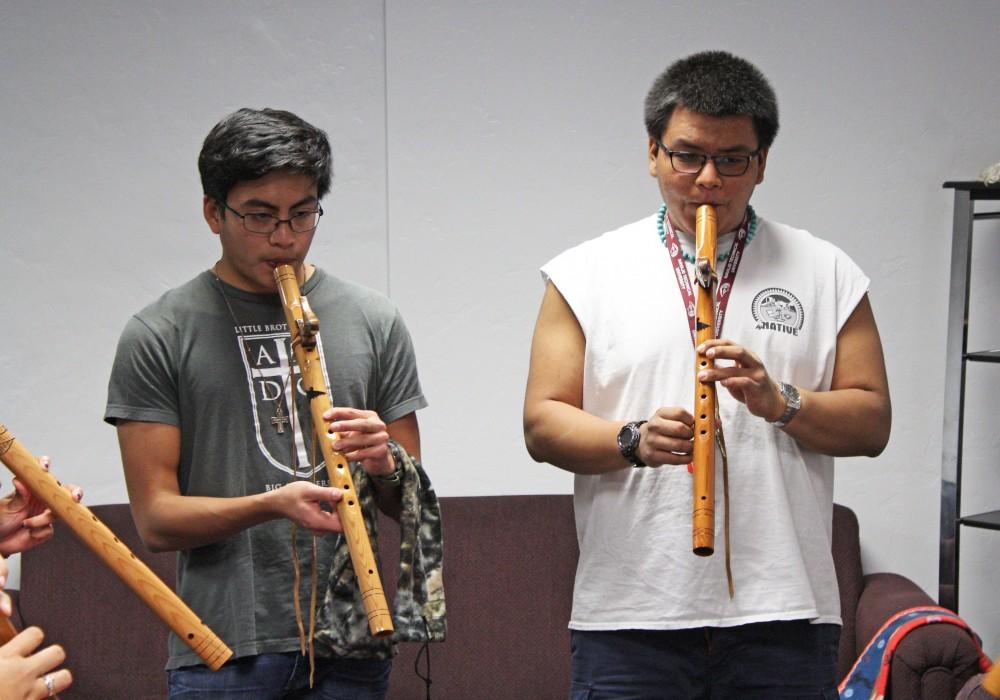 Students participating in the wind flute workshop try out their flutes by playing a song as a part of the event for Native American Hertiage month in the Robert L. Nugent Building on Nov. 14.
