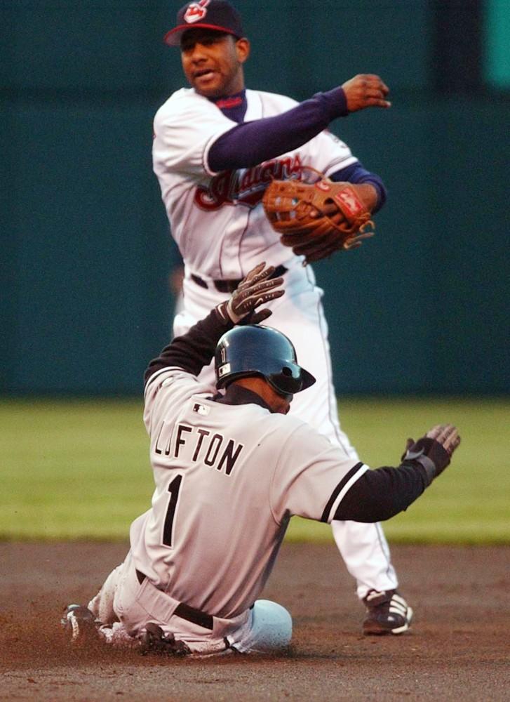 Cleveland's Ricky Gutierrez tags Chicago's Kenny Lofton out in this double play during the third inning of a game on April 23, 2002.