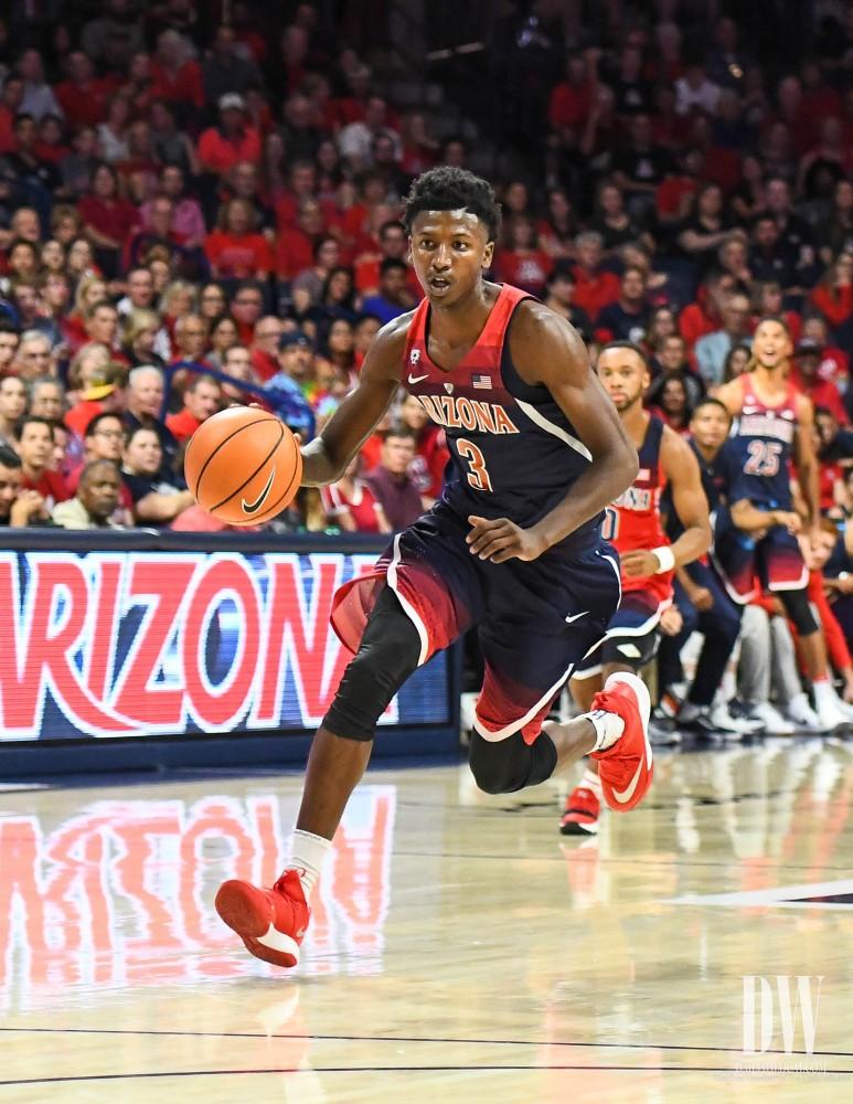 Dylan Smith runs toward the basket during the McDonald's Red-Blue game on Oct. 20 in McKale Center.