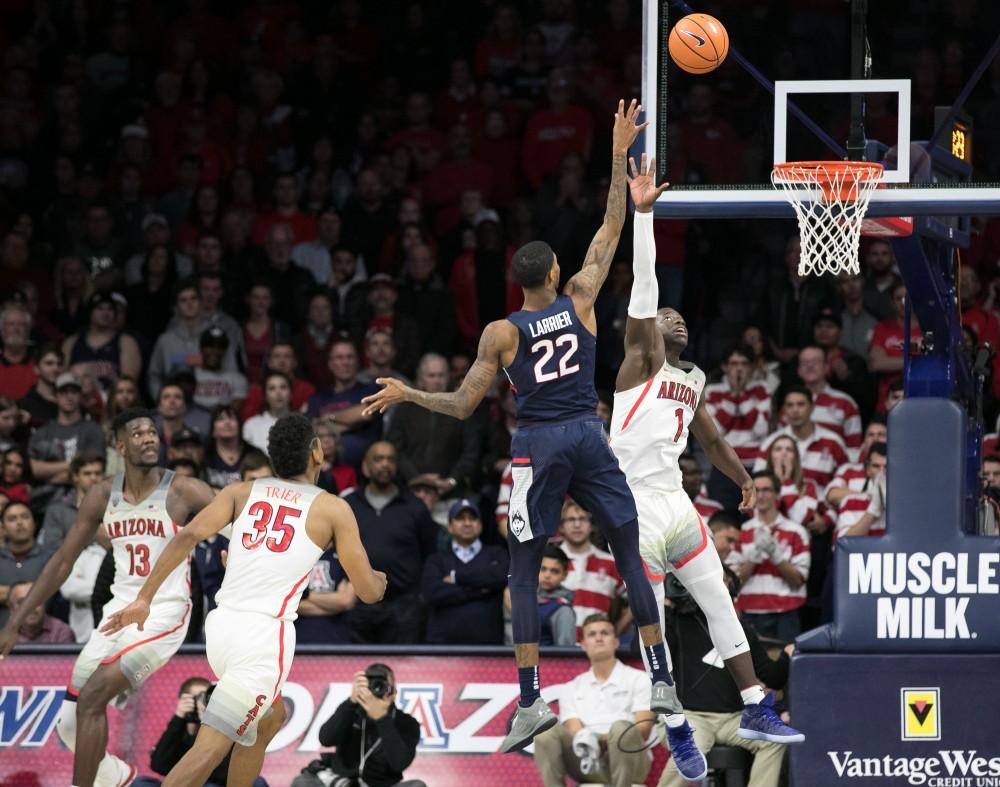 University of Connecticut's Terry Larrier (22) shoots over Arizona's Rawle Alkins (1) in the UA-UConn game. Larrier had 18 points in the game.