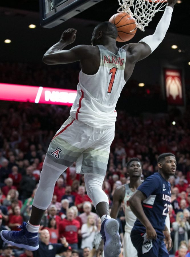 Arizonas Rawle Alkins finishes off a dunk during the UA-UConn game. Alkins led the wildcats in scoring with 20 points.
