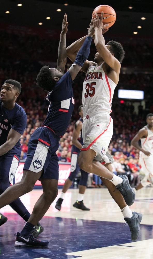 Arizona's Allonzo Trier tries to shoot past a UConn defender in the second half. Trier recorded 15 points.