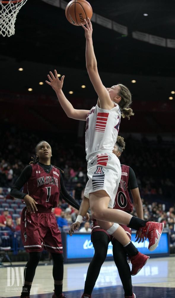 Arizona's Lindsey Malecha lays in the ball against the New Mexico State Aggies on Thursday, December 14.  Malecha had five points in the game.