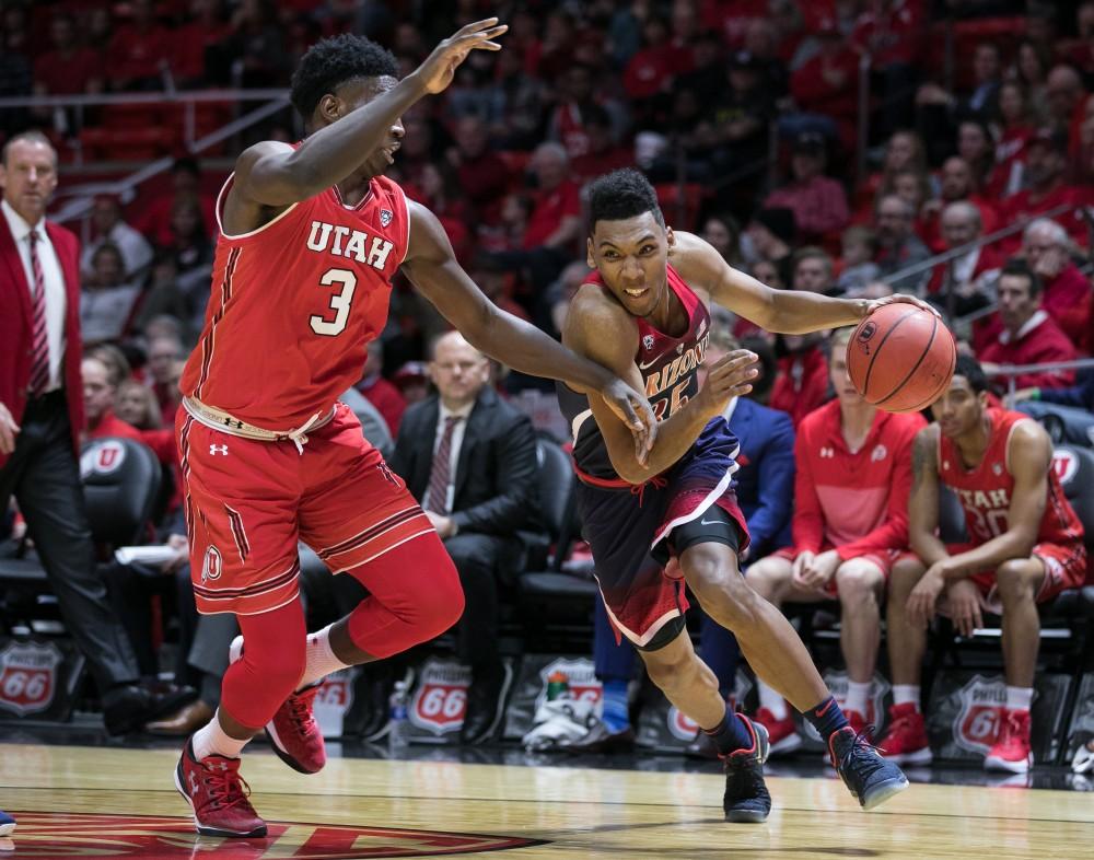 Arizona's Allonzo Trier blows past Utah's Donnie Tillman (3) in the first half of the Utah-Arizona game. Trier ended the game with seven points.