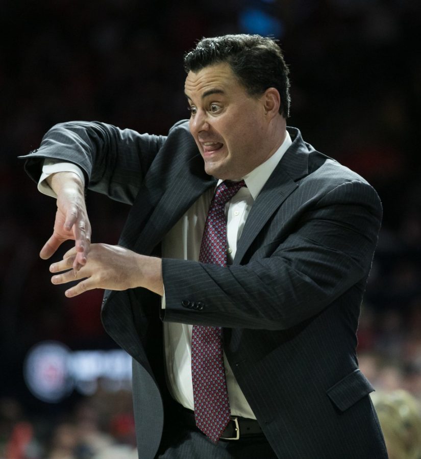 Arizona+Head+Coach+Sean+Miller+animatedly+describes+a+defensive+play+to+the+Arizona+players+on+the+court.