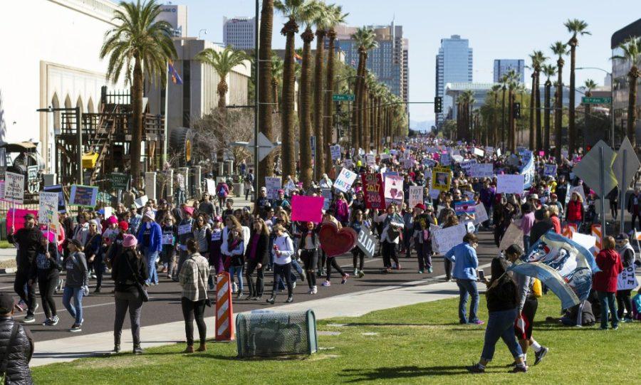 People make their way toward the Arizona State Capitol as part of the Womens March to the Polls march in Phoenix Sunday, Jan. 21. The Phoenix Police Department estimated between 20,000 and 25,000 people participated in this year’s march, similar to last year’s Phoenix march turnout.