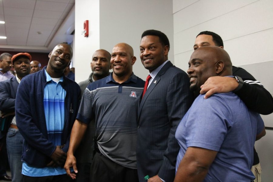 Kevin Sumlin was introduced Tuesday, Jan. 16 as Arizonas next head football coach. Sumlin, who was let go by Texas A&M in December, poses with past UA football players.