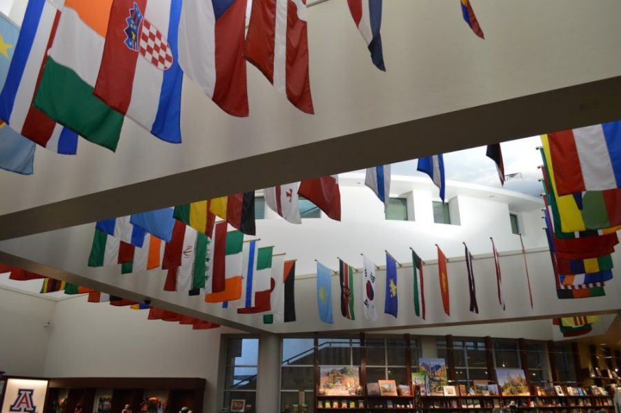 The International Flag Display hangs in the backdrop of the U of A Bookstore on January 25, 2018. The showcase of flags is the largest in the state of Arizona and serves as a symbol of the diverse student body.