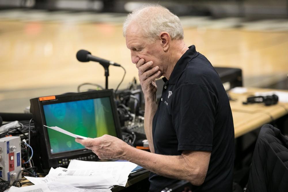 Announcer Bill Walton looks over pregame stats before he calls the UA-Colorado game.