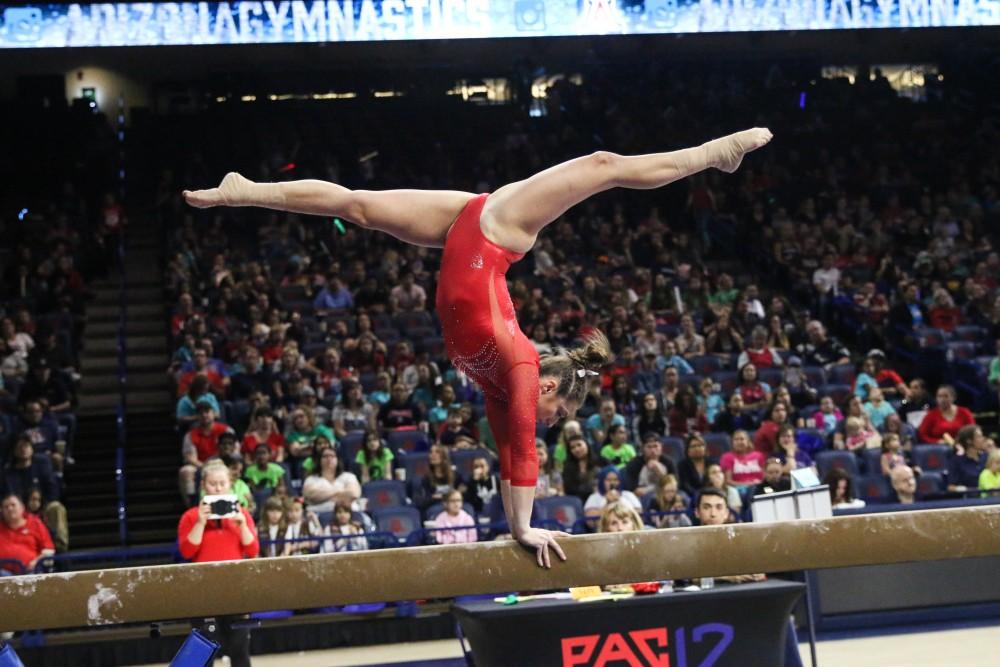 Arizona gymnastics senior Madison Cindric competes on the balance beam against Denver on Jan. 6 in McKale Center. 
