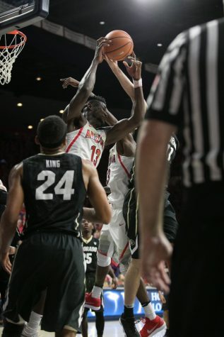 A tangle of limbs fight Arizona's Deandre Ayton (13) for an offensive rebound.