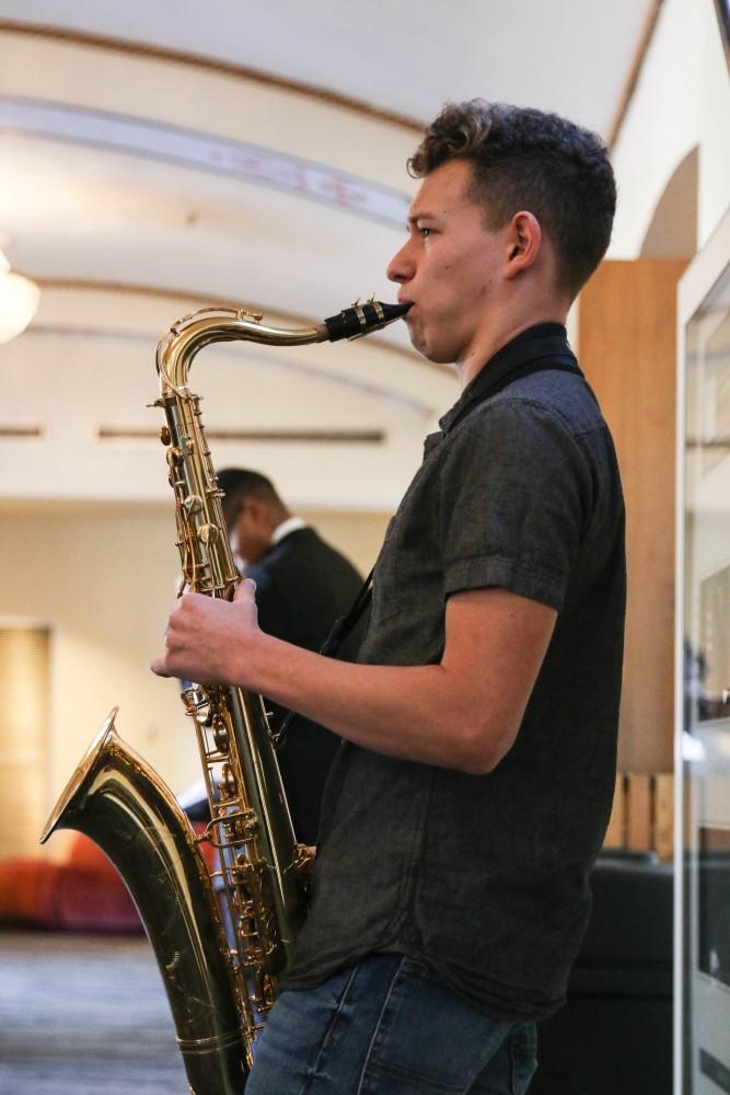 A local performer plays his saxophone for a crowd during the Beyond Tucson event this MLK weekend.