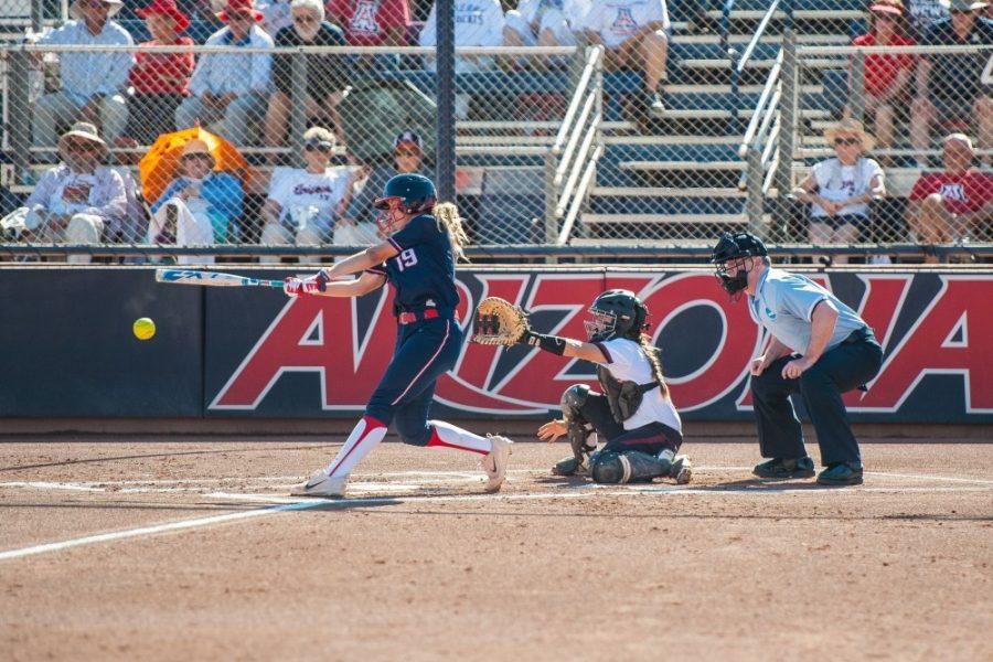 Arizona infielder Jessie Harper (19) hits the ball during the Arizona-South Carolina softball game on May 21 at Hillenbrand Stadium.