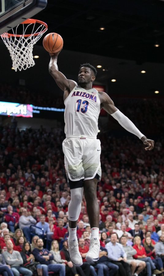 Arizonas Deandre Ayton goes for a one-handed dunk on a fastbreak during the second half of the UA-OSU game. Ayton finished the game witha double-double of 14 points and 10 rebounds.