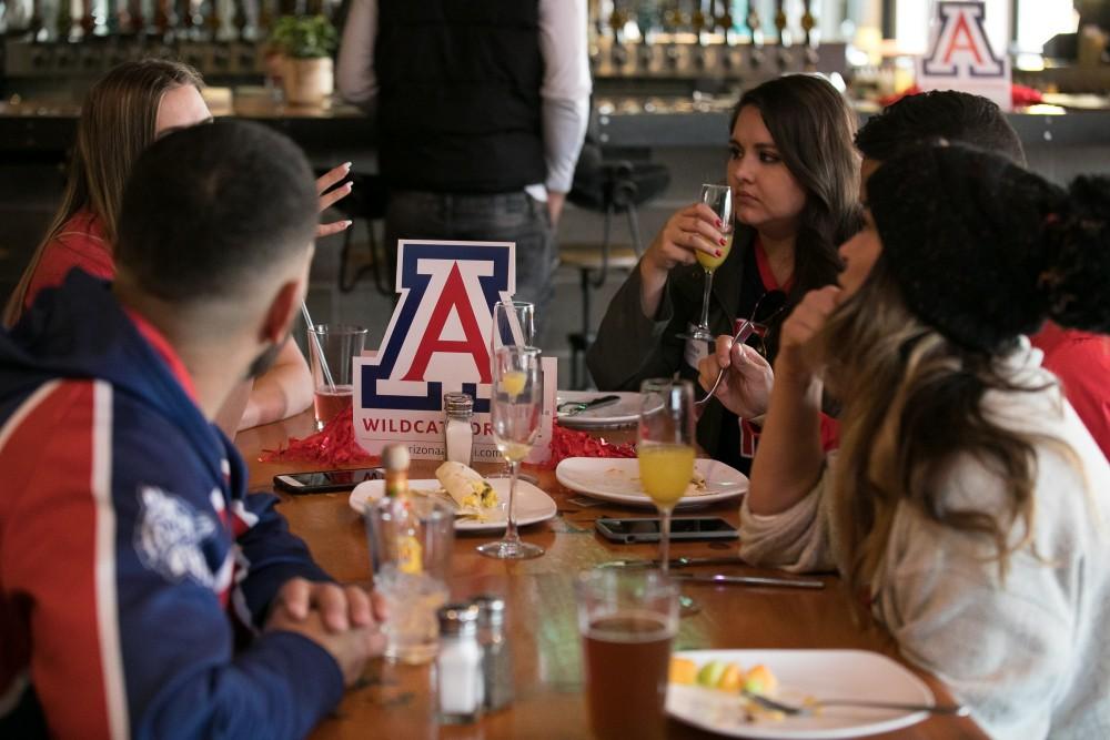 Members of the Colorado Cats chapter of the UA alumni association have brunch in Fate Brewery in Boulder, Co.