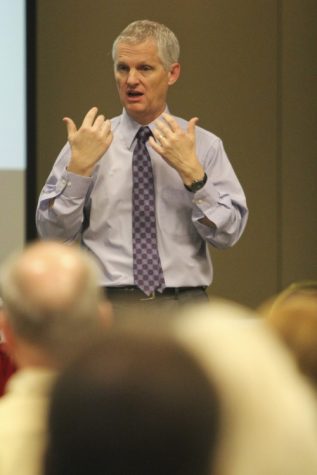 UA Provost Andrew Comrie addresses members of the community at a town hall meeting on Nov. 16.