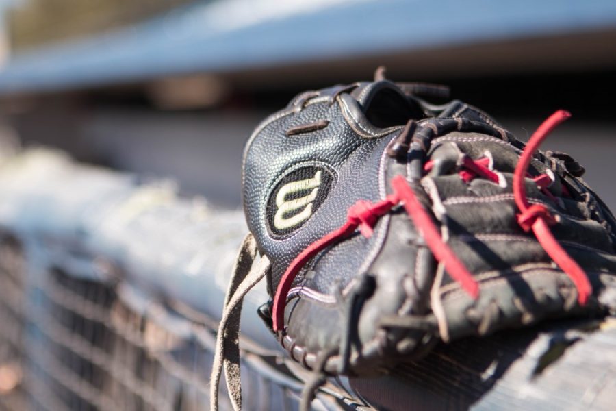 A baseball glove sits on the railing of the Hi Corbett Field.
