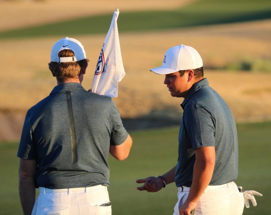 Head coach Jim Anderson (left) and David Laskin (right) converse during the Arizona Intercollegiate Golf Tournament on Jan. 29, 2018. Arizona took the title of first place at the conclusion of the tournament.