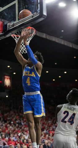 UCLA's Jaylen Smith (4) jumps th eball in past Arizona's Emmanuel Akot (24) during the first half of the UA-UCLA game on Thursday, Feb. 8 at McKale Center in Tucson, Ariz.