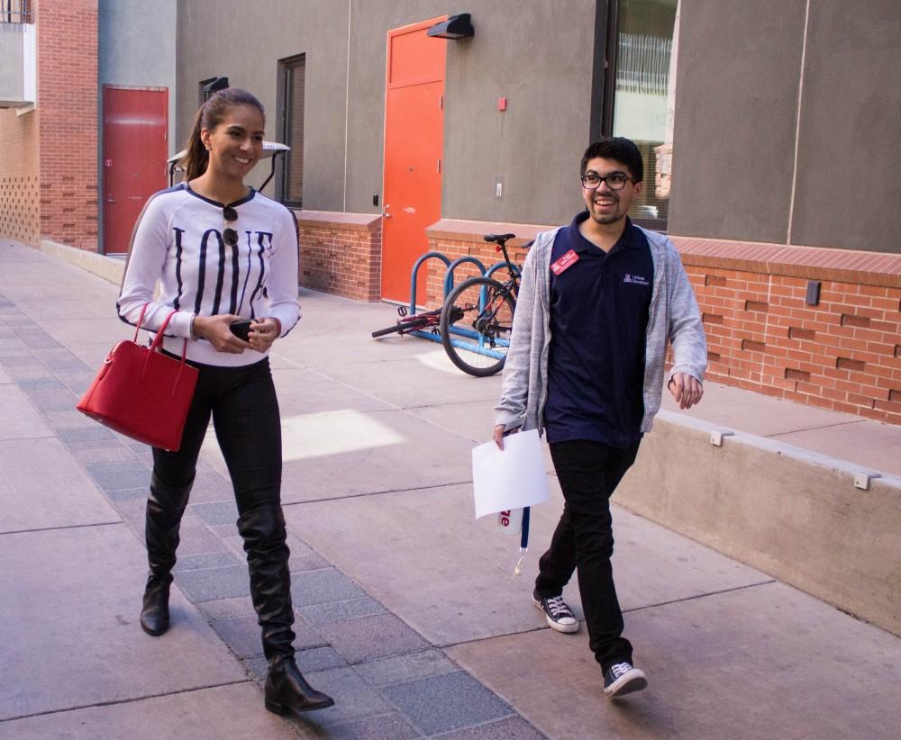 Jorge Mata Ochoa, a student ambassador for the UA, takes Vianey Durazo through a spanish speaking walking tour of the UA campus on Monday, Feb. 26. Vianey is a 22-year-old transfer student from Cochise College and is hoping to study at the Eller College of Management in the University of Arizona, in Tucson, Ariz.