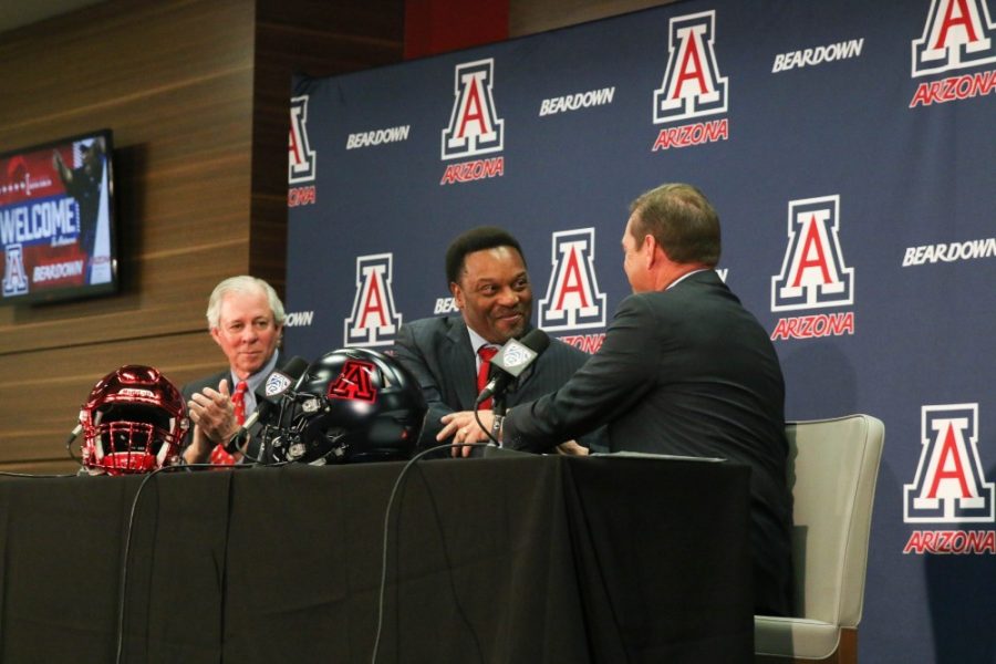 Newly+hired+head+football+coach%2C+Kevin+Sumlin%2C+shakes+hands+with+athletic+director+Dave+Heeke+during+the+press+conference+held+this+Tuesday%2C+Jan.+16.