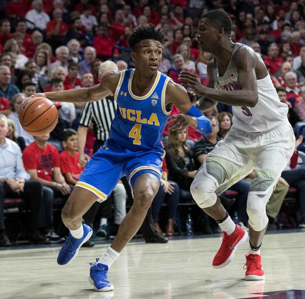 UCLA's Jaylen Hands looks to drive past Arizona's Dylan Smith (3) during the fist half of the UA-UCLA game on Thursday, Feb. 8 at McKale Center in Tucson, Ariz. Hands had 11 points in the game.