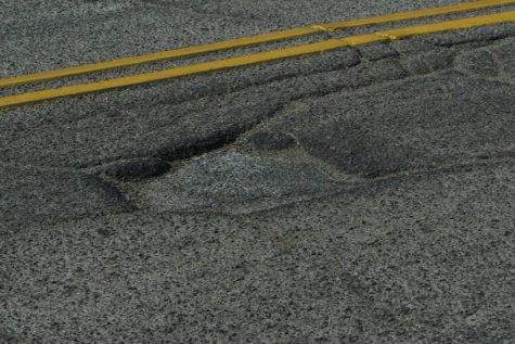 Potholes, such as the one above, appear all over the streets throughout the city of Tucson, Ariz.