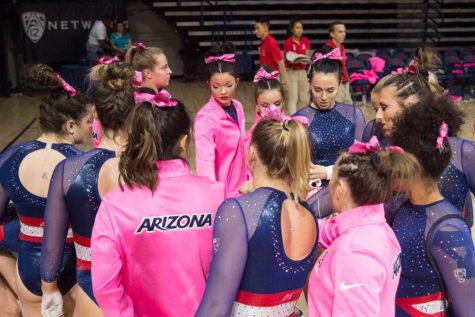 The UA Gymnasts do a break before they head in to the second rotation during the UA v Stanford meet on Jan. 11 in Mckale Center.