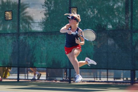 Arizon'a Sophia Thomas jumps up to return a shot over the net during a match against The University of Houston on Feb. 11, at the Robson Tennis Center, in Tucson, Ariz.