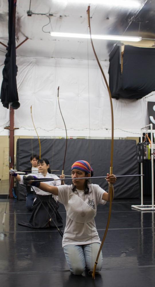 Cheng Tao, left, Miwa Yamamura, middle, and Barbara Quintana, right, go through a Kyudo ceremony during their practice on Sunday March 18 at the Rhythm Industry Performance Factory in Tucson Arizona. Kyudo is an ancient form of Japanese archery which focuses on a meditative approach to shooting.