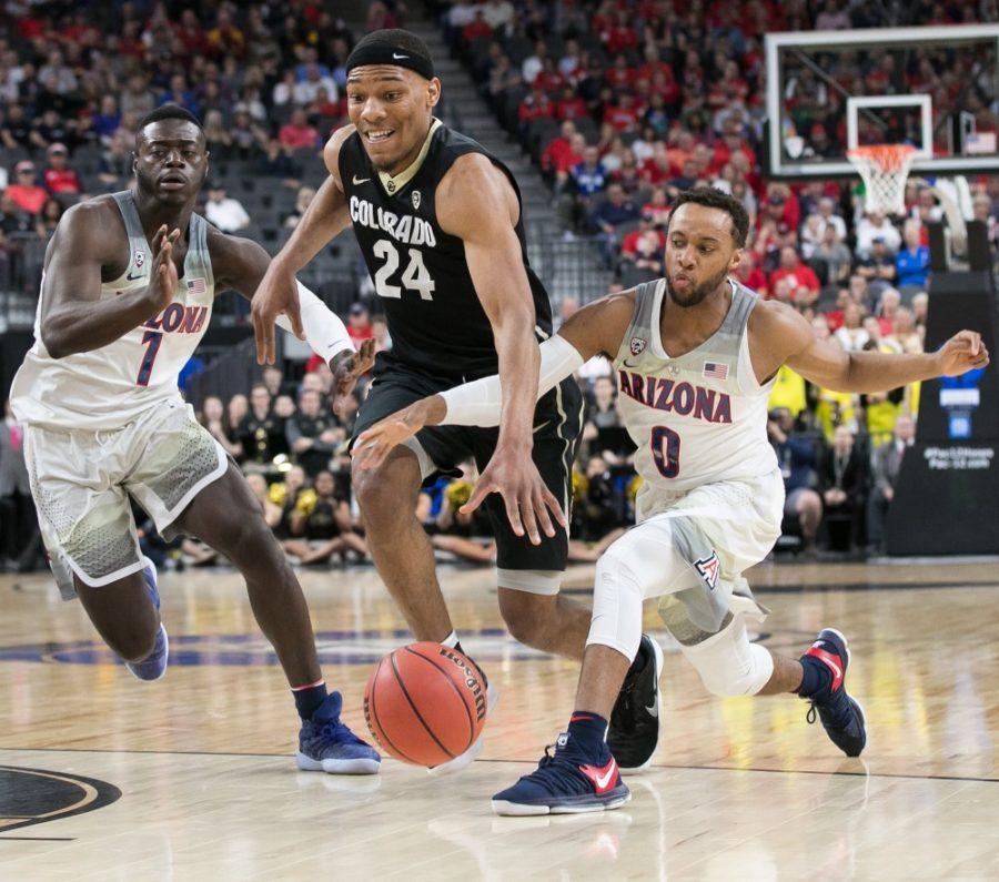 Colorados George King (24) drives past Arizonas Rawle Alkins (1) and Parker Jackson-Cartwright (0) in the first half of the Colorado-Arizona Quarterfinal game at the 2018 Pac-12 Tournament on Thursday, March 8 in T-Mobile Arena in Las Vegas, Nev.