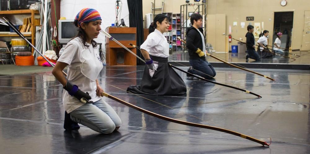 Barbara Quintana, left, Miwa Yamamura, middle, and Cheng Tao, right, go through a Kyudo ceremony during their practice on Sunday March 18 at the Rhythm Industry Performance Factory in Tucson Arizona. Kyudo is an ancient form of Japanese archery which focuses on a meditative approach to shooting.