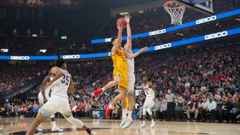 Arizona's Dusan Ristic, rear, goes to block a shot by USC's Nick Rakocevic (31) in the Arizona-USC Championship game at the 2018 Pac-12 Tournament on Saturday, March 10 in T-Mobile Arena in Las Vegas, Nev.