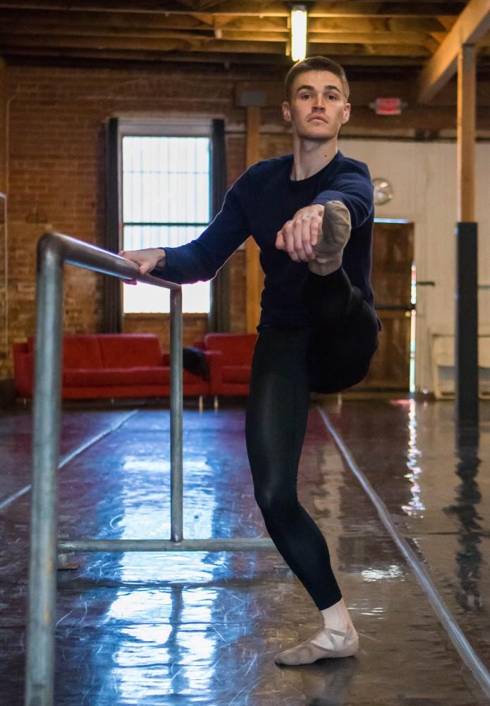 Nathan Myers, a UA alumnus with a Bachelor’s of Fine Art: Studio Art degree (emphasis in 2-D Art), stretches before performing a routine on Saturday March 17 at Artifact Dance Project in downtown Tucson, Ariz.