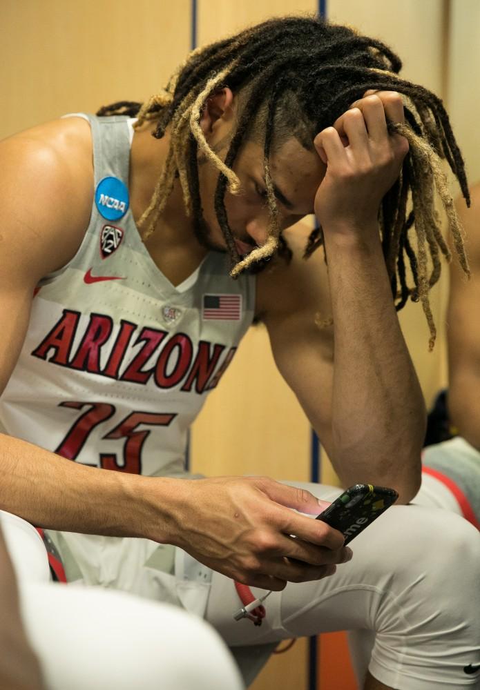 Senior Keanu Pinder takes a moment to himself after the Arizona-Buffalo game in the first round of the NCAA Tournament on Thursday, March 15 in Boise, Idaho.