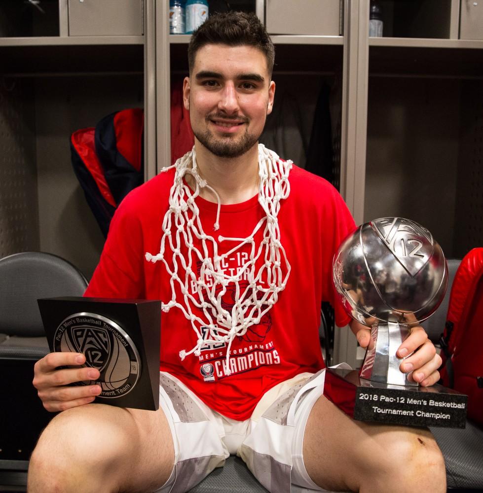 Senior Dusan Ristic holds the 2018 Pac-12 Men's Basketball trophy after the Arizona victory over USC for the Championship at the 2018 Pac-12 Tournament on Saturday, March 10 in T-Mobile Arena in Las Vegas, Nev.