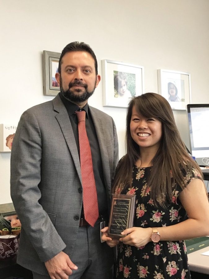 Pharmacology and neuroscience professor Rajesh Khanna, left, poses with neuroscience and cognitive science senior Lindsey Chew. The duo will head to Washington, D.C. for the Posters on the Hill summit between congressmembers and scientists from across the country.