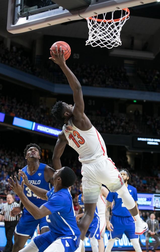 Arizona's Deandre Ayton (13) grabs a rebound over Buffalo players in the Arizona-Buffalo game in the first round of the NCAA Tournament on Thursday, March 15 in Boise, Idaho.