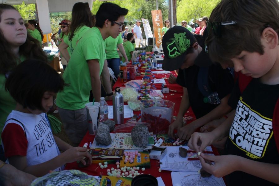 Kids making crafts at the Tucson Festival of Books on the UA Mall. Families can explore the intersection of art and science at the UA Museum of Arts Family Day on Saturday, April 29, from 10 a.m. to 1p.m.
