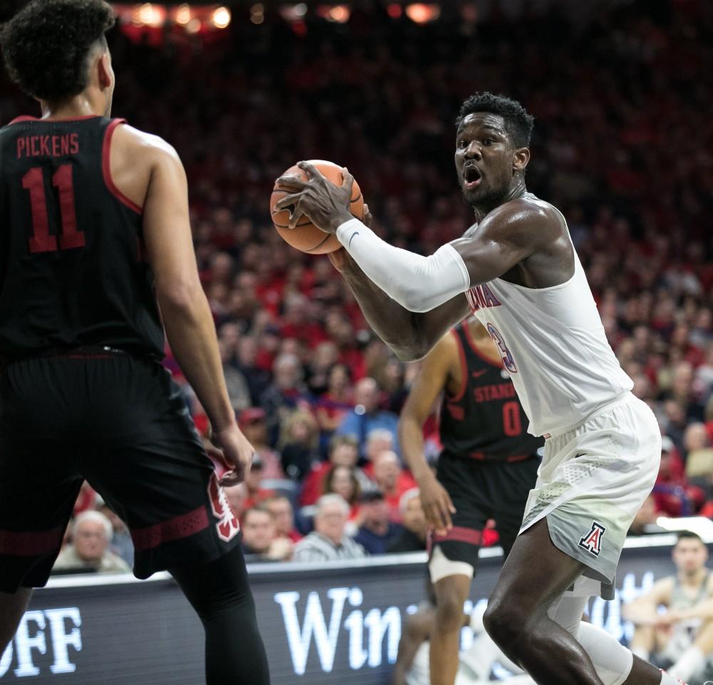 Arizona's Deandre Ayton (13) looks for a teammate to pass to after an offensive rebound during the first half of the Arizona-Stanford game on Thursday, March 1 at McKale Center in Tucson, Ariz.