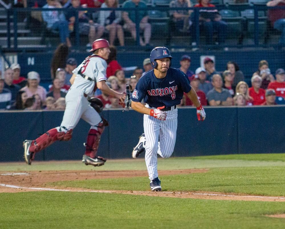 Arizona's Cal Stevenson runs to first in the second inning during the Arizona-Washington State game at Hi Corbett field on Friday March 23 in Tucson Ariz.