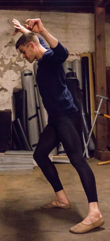 Nathan Myers, a UA alumnus with a Bachelor’s of Fine Art: Studio Art degree (emphasis in 2-D Art), practices in the basement of Artifact Dance Project to incorporate the sound of sand in his performance on Saturday March17.