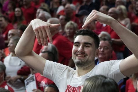 Arizona Senior Dusan Ristic waves over many supporters after the Arizona-Cal game on Saturday, March 3 in McKale Center.