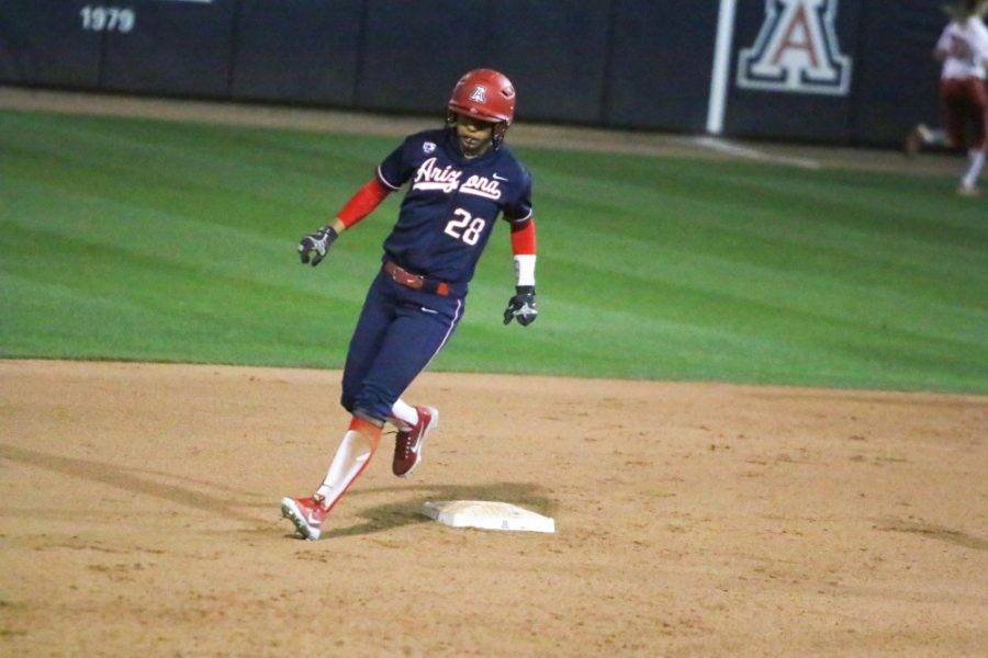 Arizonas Ashleigh Hughes (28) makes it safely to second base during the Arizona-Utah game on Saturday, March 17 at Hillenbrand Stadium in Tucson, Ariz.