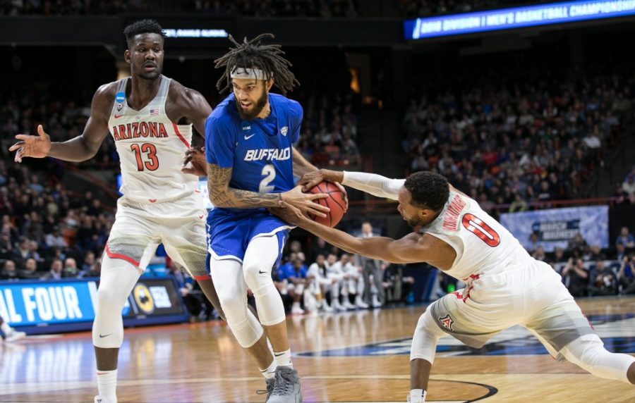 Arizonas Parker Jackson-Cartwright (0) strips the ball away from Buffalos Jeremy Harris (2) in the Arizona-Buffalo game in the first round of the NCAA Tournament on Thursday, March 15 in Boise, Idaho.