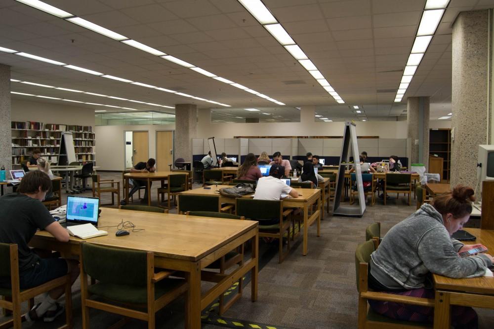 Students study at the University of Arizona main library on March 13.