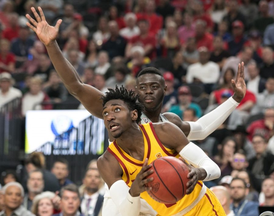 USCs Jonah Mathews, front, looks to score past Arizonas Rawle Alkins, rear, in the Arizona-USC Championship game at the 2018 Pac-12 Tournament on Saturday, March 10 in T-Mobile Arena in Las Vegas, Nev.